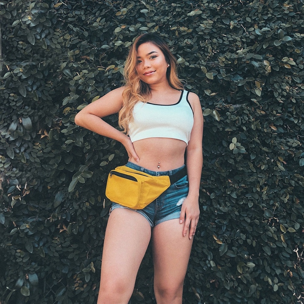 White top and yellow fanny pack